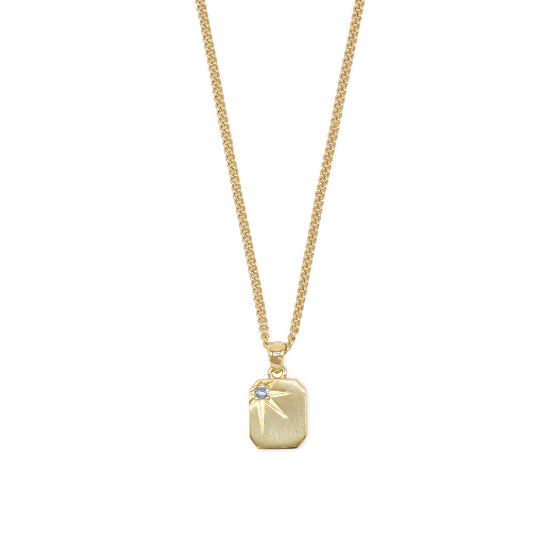 Gold plated Silver necklace with a rectangular pendant, oversized star setting and pale blue gemstone