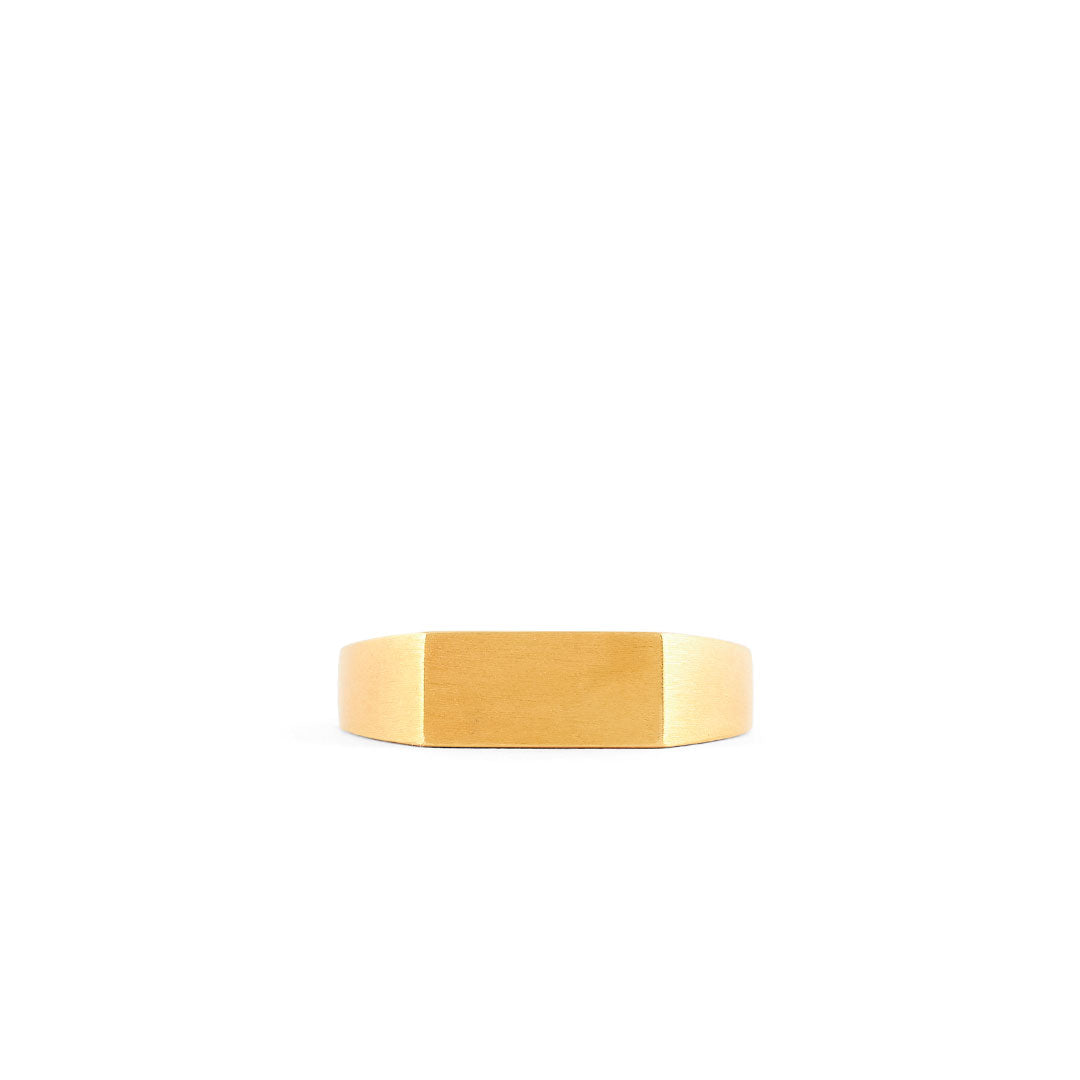 Gold plated Silver ring with a Rectangle shaped face and heavy brushed finish on a white background