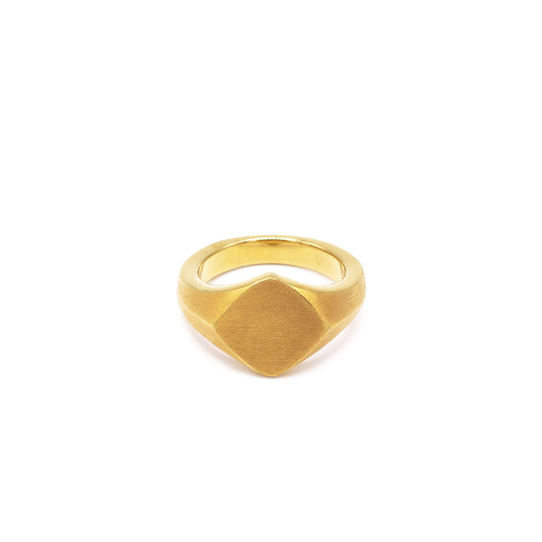 Gold plated silver ring with a Rhombus shaped face and heavy brushed finish on a white background