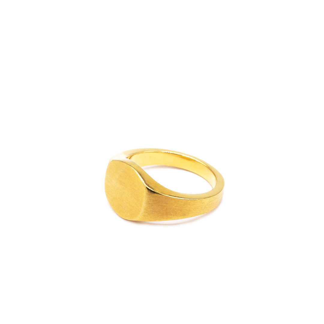 Gold plated Silver ring with a round face and a heavily brushed finish on a white background