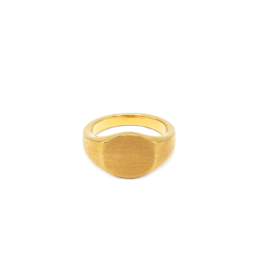 Gold plated Silver ring with a round face and a heavily brushed finish on a white background