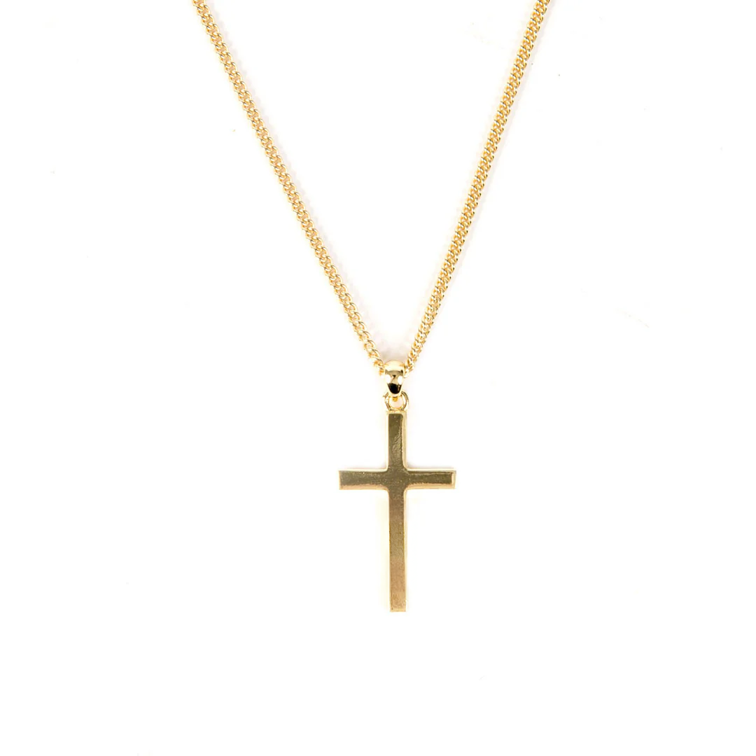 Gold Plated Sterling Silver cross pendant necklace with a curb chain in gold plating angled view showing depth - serge denimes
