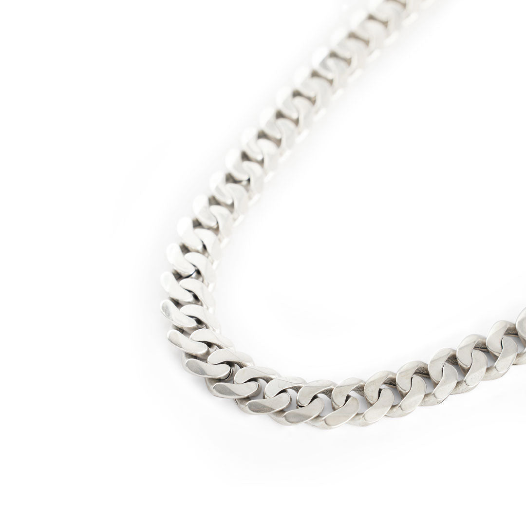Very thick Silver 12mm curb chain necklace on a white background