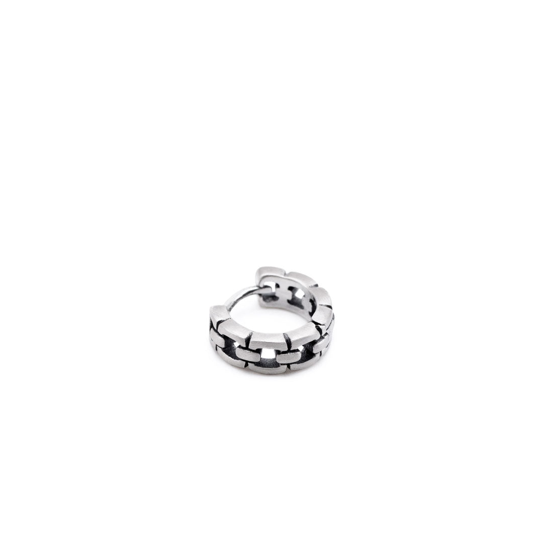 Sterling Silver huggie earring with a square cut out design in a closed position by Serge DeNimes