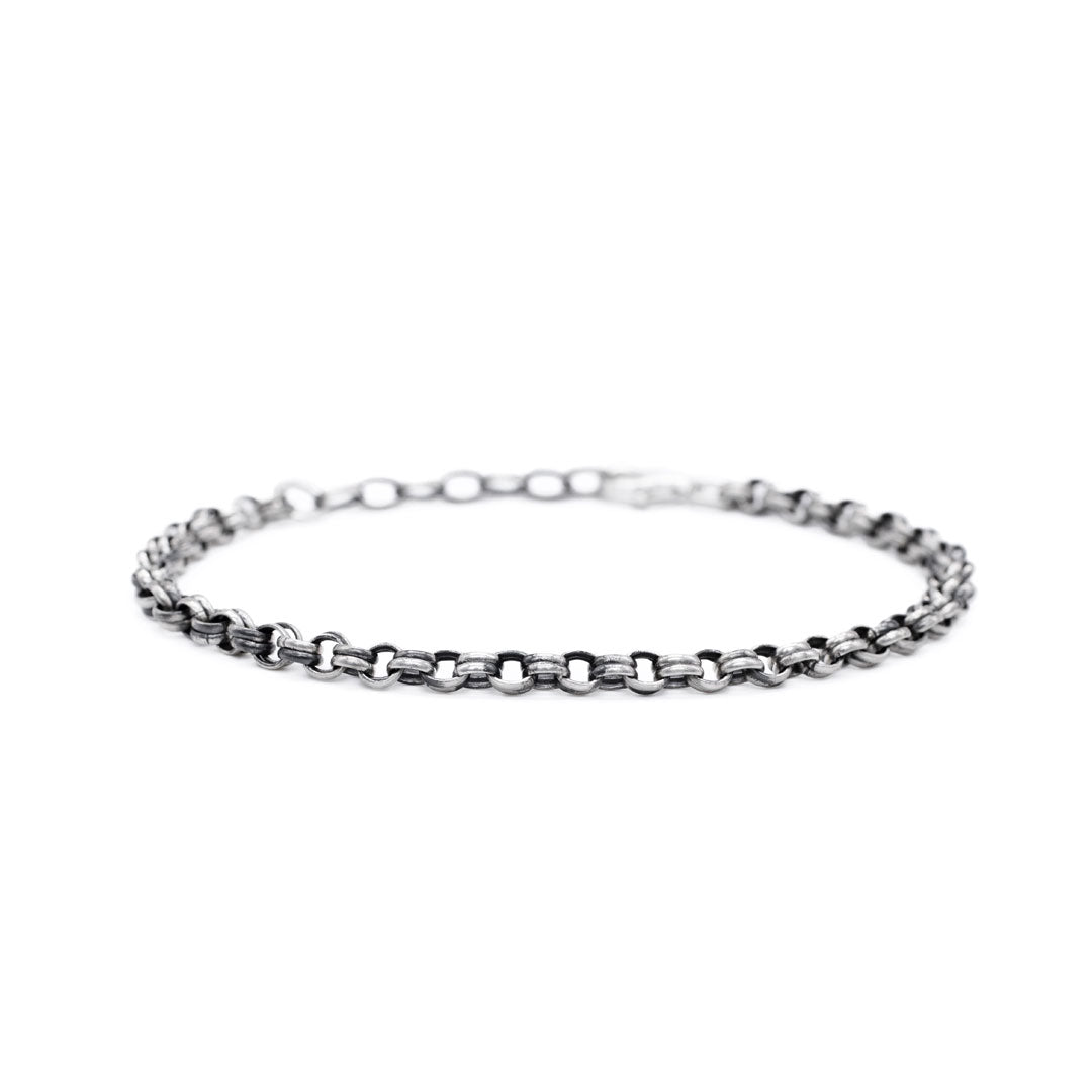 Silver chain bracelet on a white background